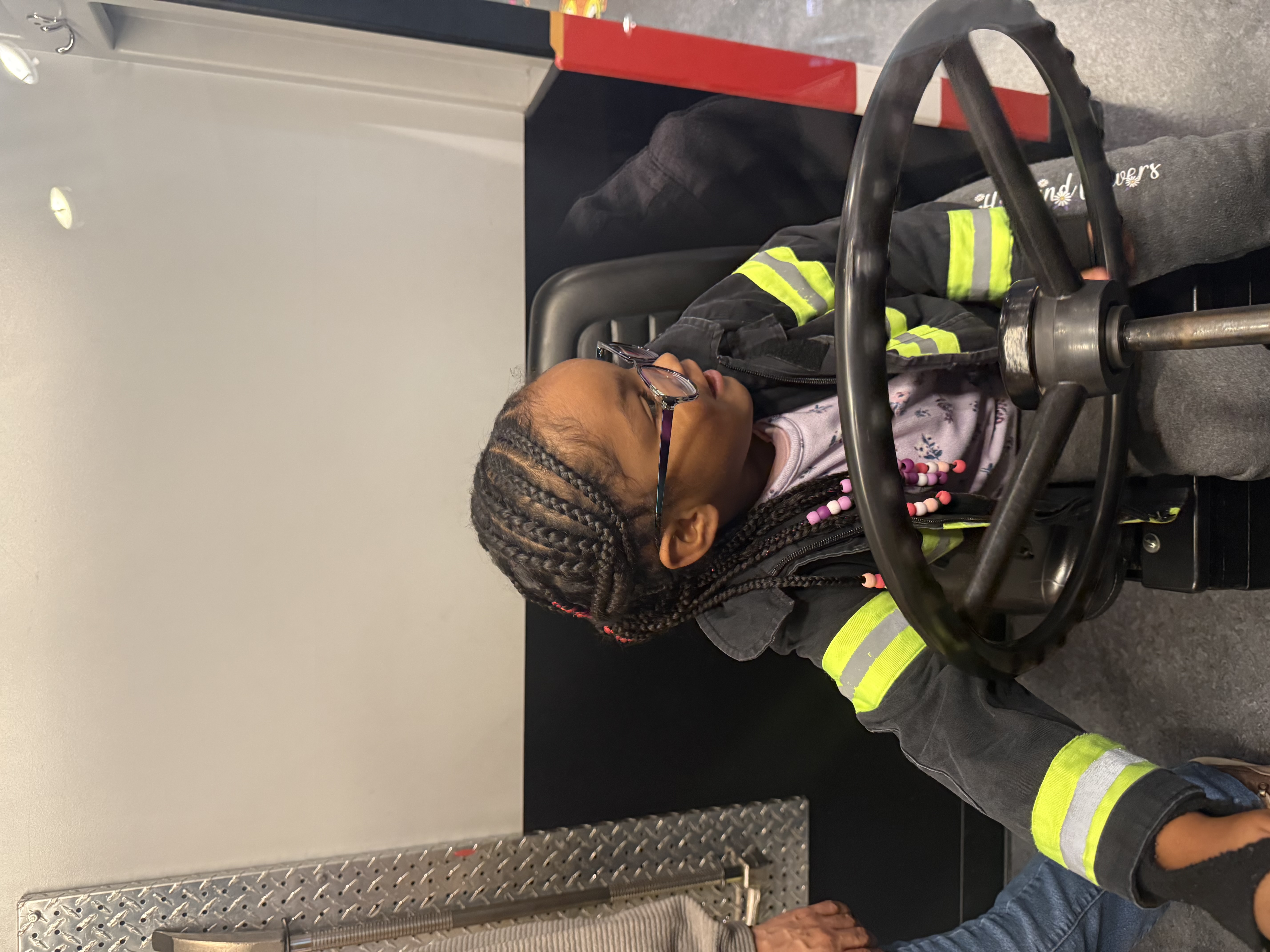 Lei Lei driving the firetruck